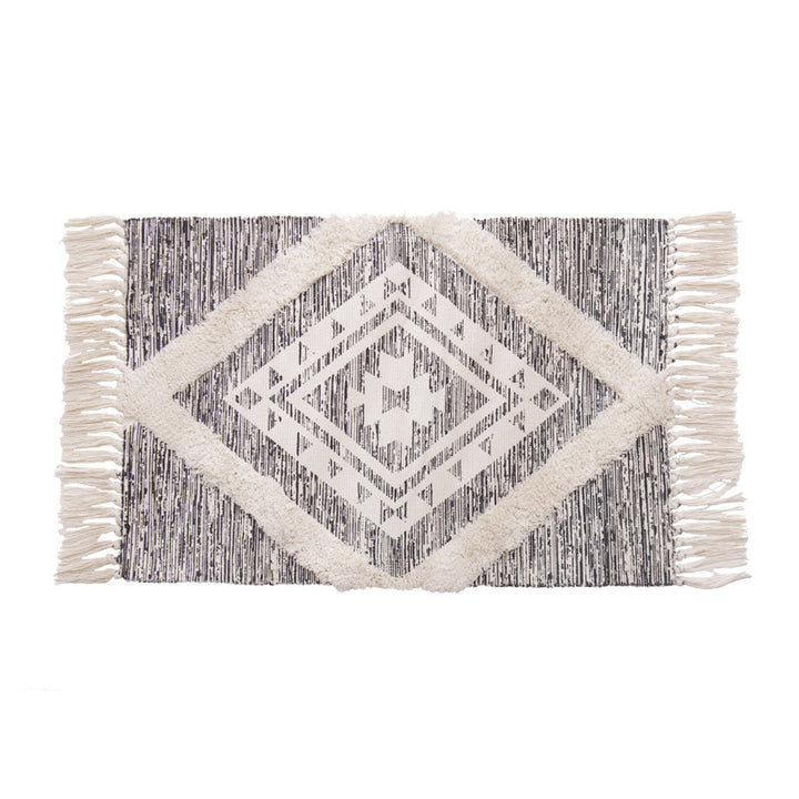 Hand-tufted cotton bath mat with botanical pattern and decorative fringes