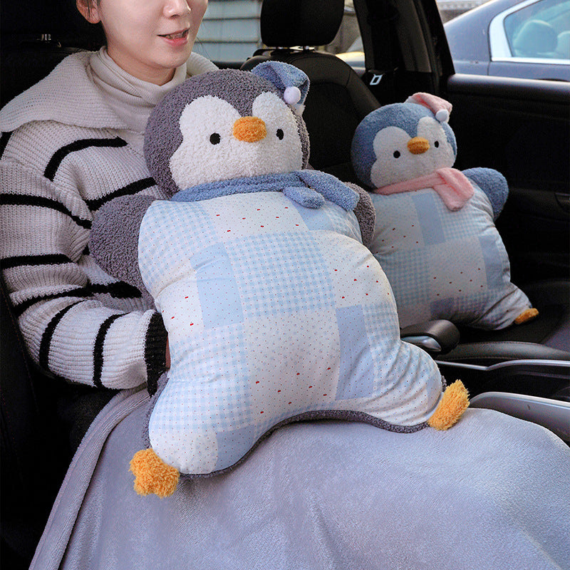 Cozy plush pillow with integrated blanket in penguin look
