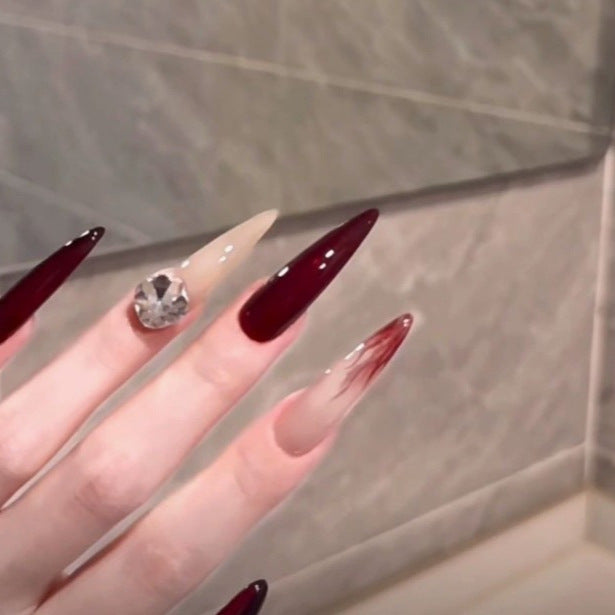 Elegant Stiletto Nail Enhancements with Gem Accents Kalsten