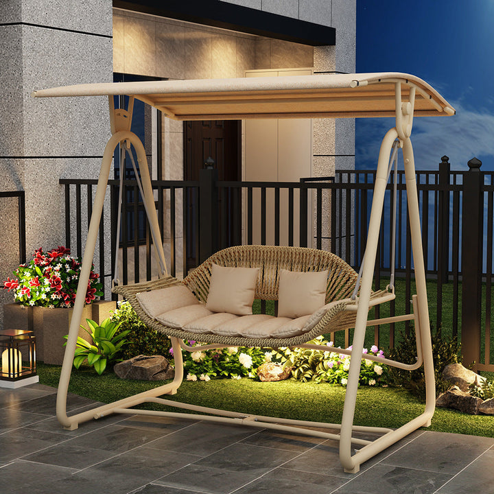 Woven rattan outdoor swing loveseat with padded cushions and powder-coated steel frame Kalsten