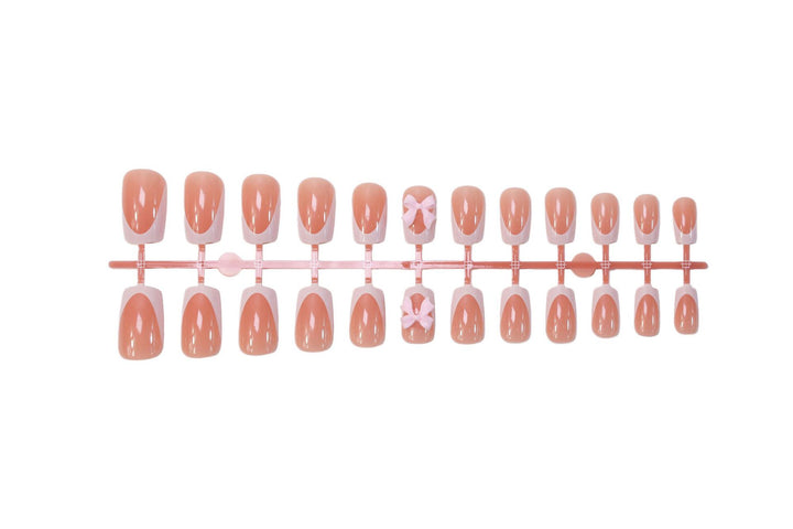 Acrylic nail set with elegant tips and playful bows Kalsten
