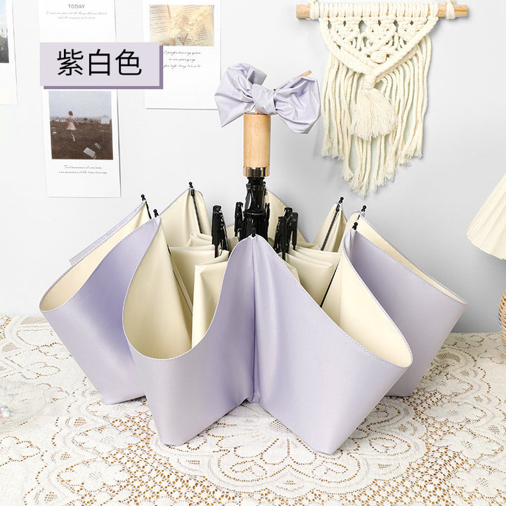 Ladies elegant folding umbrella in portrait format with stylish wooden handle Kalsten