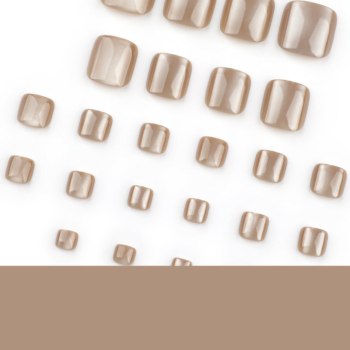 Artful nail art with glitter accents and soft ombre effect Kalsten