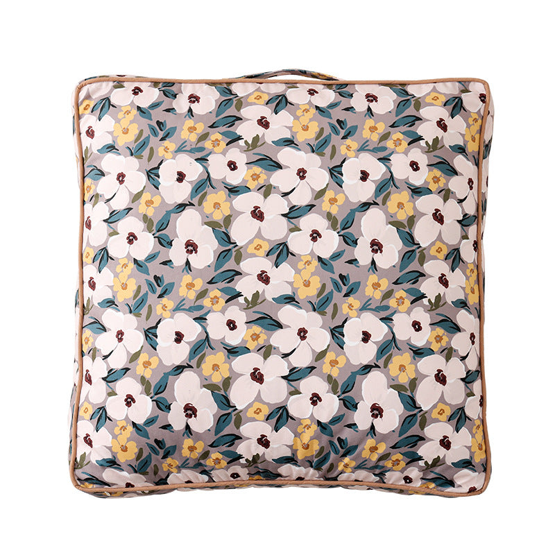 Large decorative seat and floor cushion with floral pattern