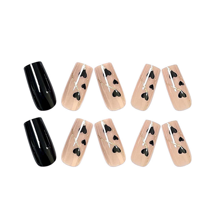 Artistic acrylic nails with heart design and glitter accents Kalsten