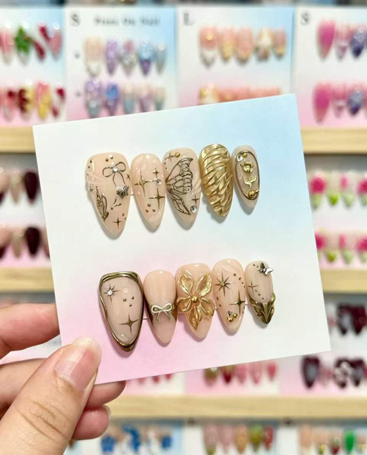 Artistic Press-On Nails Set with Gold and Floral Embellishments