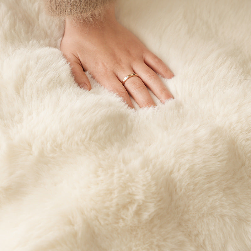 Plush floor cushion pouf with padded filling and faux fur cover