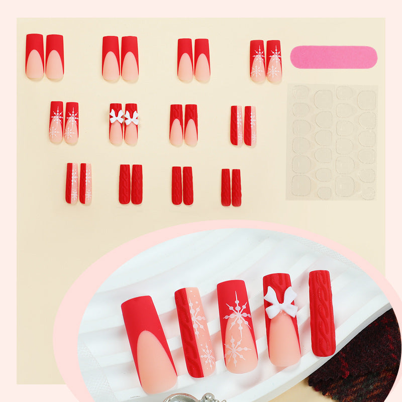 Artificial nail set with festive snowflake and bow motifs Kalsten