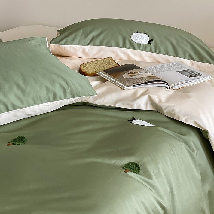 Reversible cotton satin duvet cover set with embroidered sheep and tree appliqués