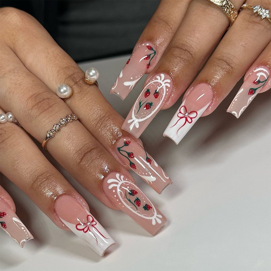 Artful nails with strawberry motifs and bow accents Kalsten