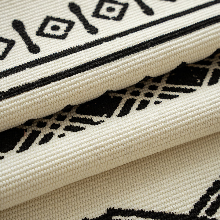 Boho table runner made of a cotton mix with embroidered ethnic motif and fringes
