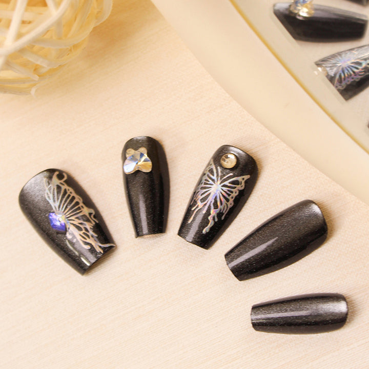 Artificial nails with decorative butterfly designs and glitter accents Kalsten