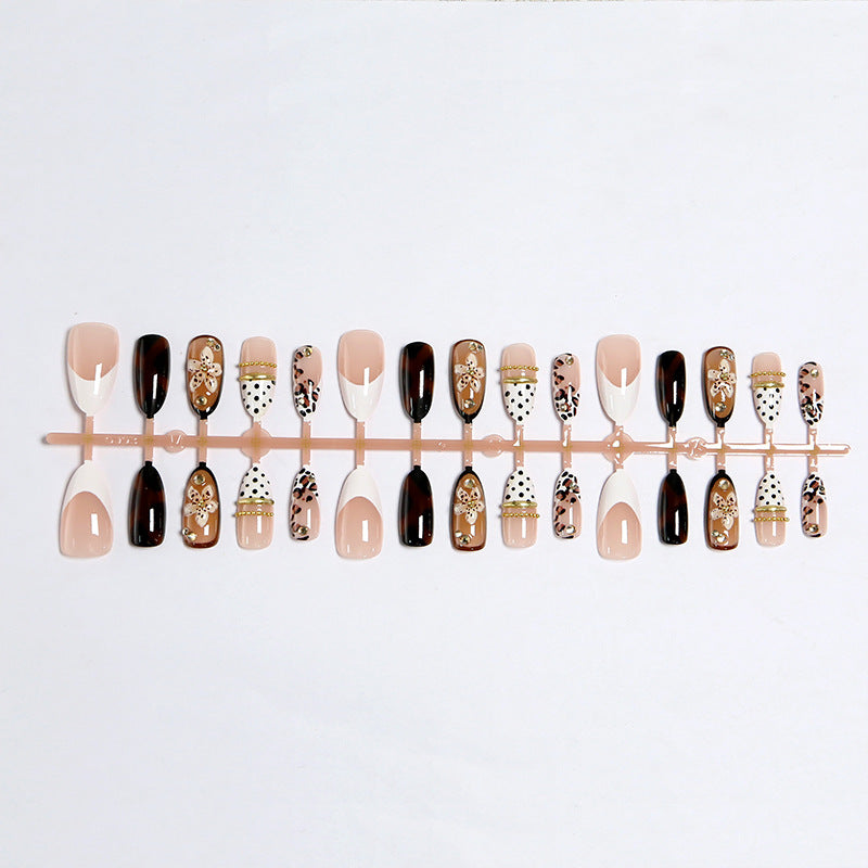 Exquisite nail art with elegant embellishments Kalsten