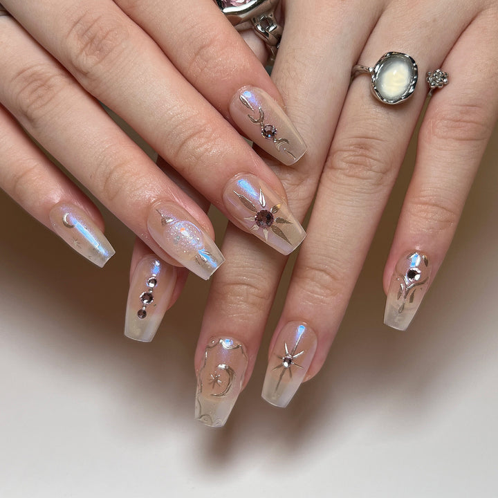 Artificial nail art with elegant rhinestone and glitter effects Kalsten