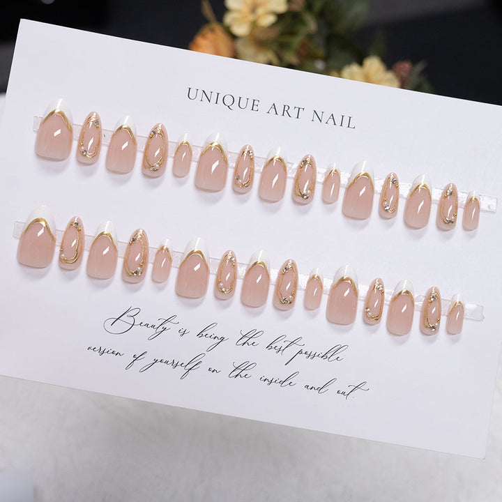 Decorative Press-On Nail Art with Gold Accents