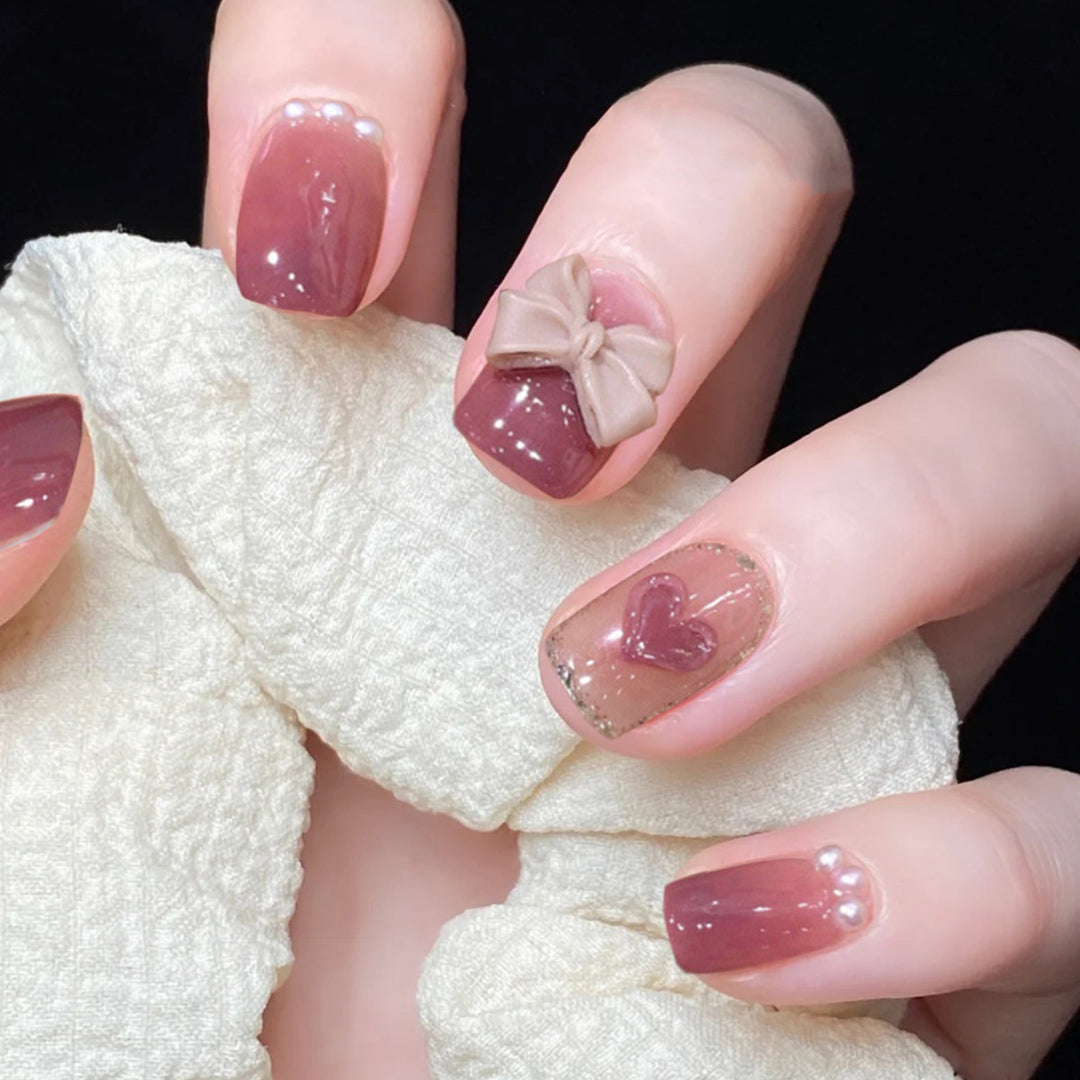 Artful Nail Art with Bow and Heart Design Kalsten