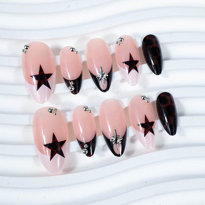 Acrylic nail set with creative star patterns and glitter accents Kalsten