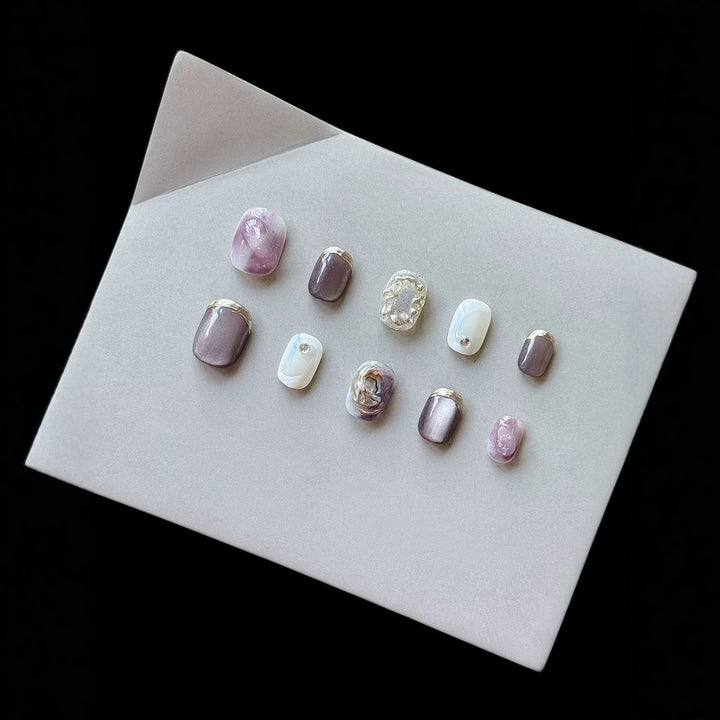 Artistic Press-On Nail Art Set with Unique Ombre and Metallic Accents