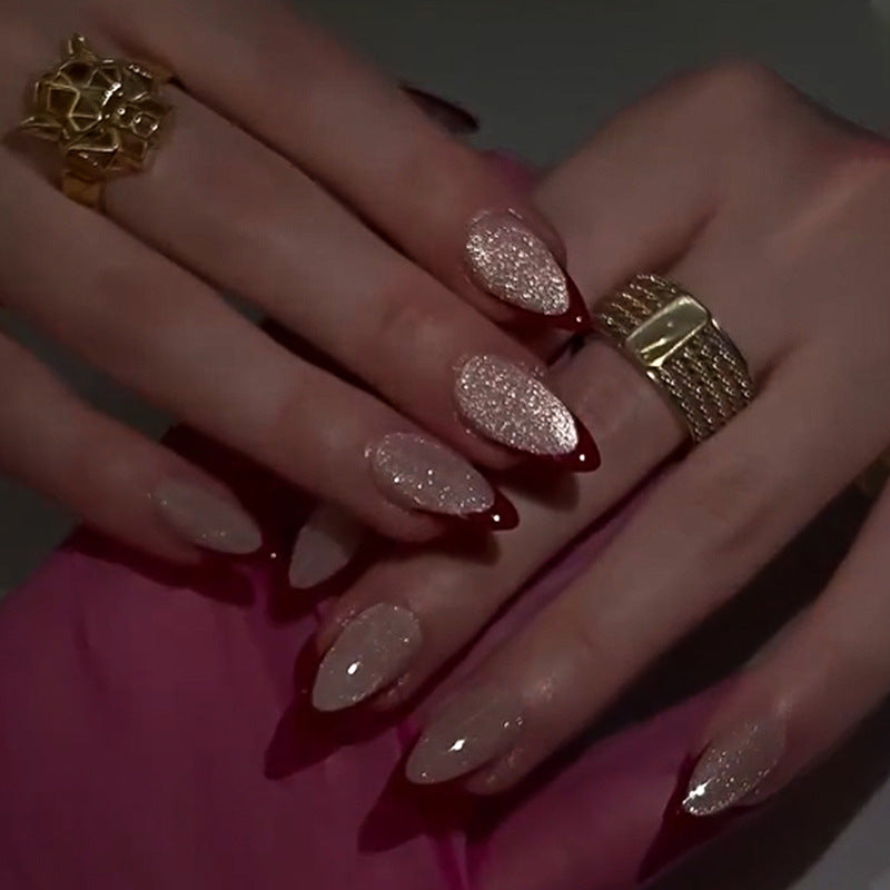 Artificial stiletto nails with sparkling tips Kalsten