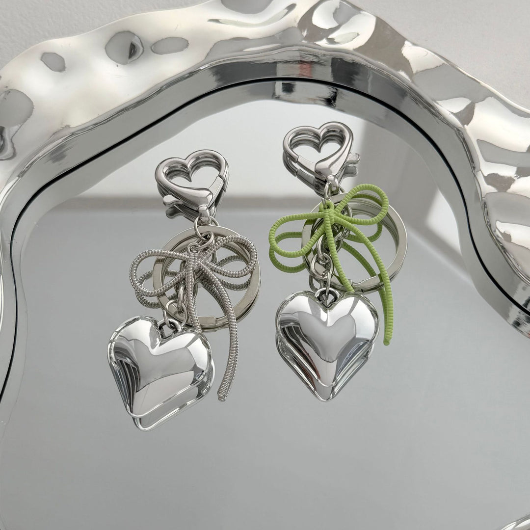 Heart-Shaped Metallic Keychain with Decorative Bow Kalsten