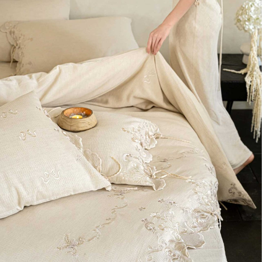 Luxurious embroidered linen bedding set with lace edge