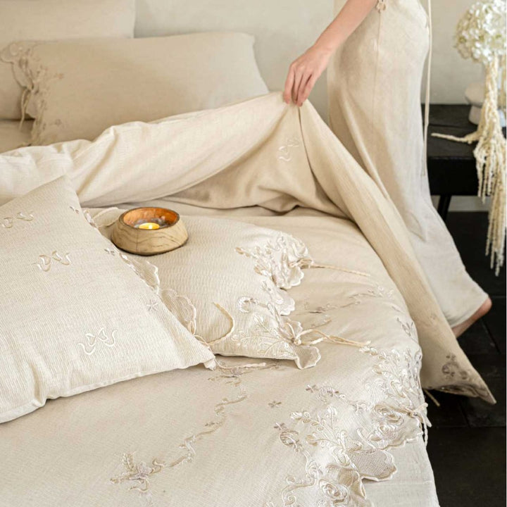 Luxurious embroidered linen bedding set with lace edge