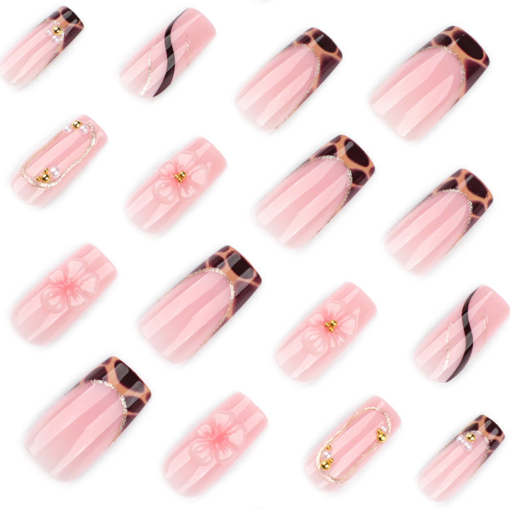 Artificial nail art with flower and glitter effects Kalsten