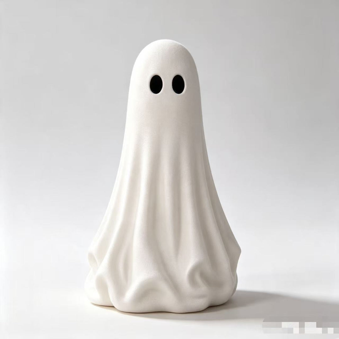 Playful ceramic decorative figure in ghost form with bow detail