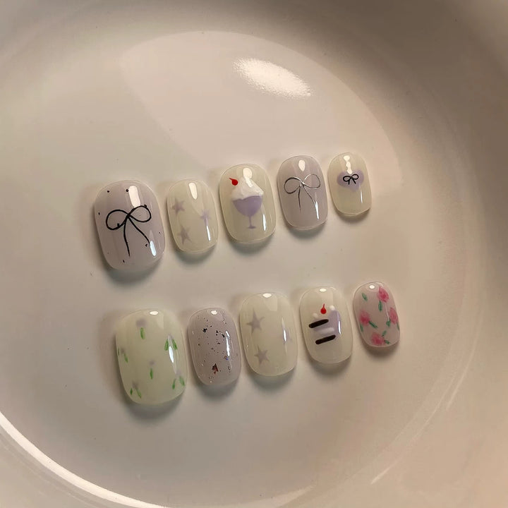 Artistic Press-On Nail Art Set with Cute Cake and Ribbon Designs