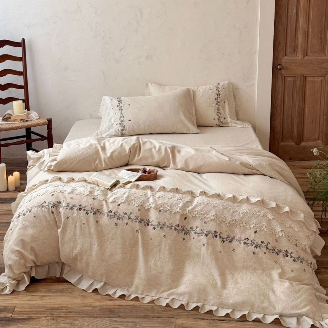 Romantic bedding set made of linen look with floral embroidery, lace trim and frill
