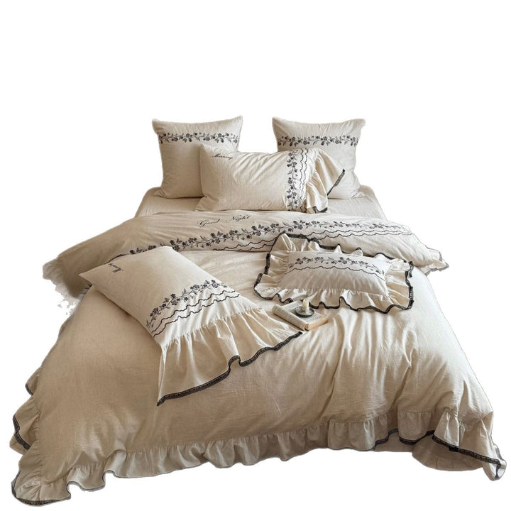 Bedding set with embroidered ruffles and linen look