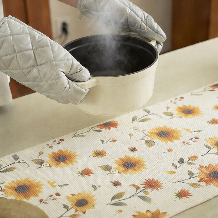 Woven table runner with floral embroidery and fringe trim