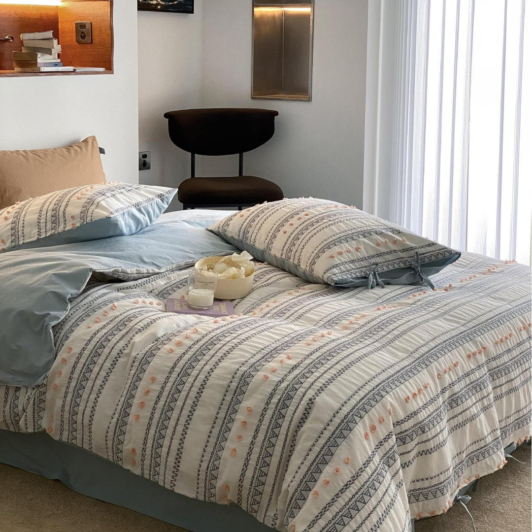 Striped bedding set made of cotton percale with embroidery dots and ties