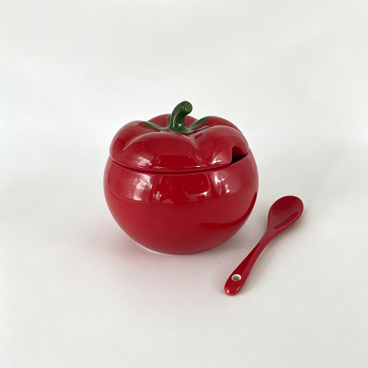 Ceramic storage jar in pumpkin shape with lid and spoon