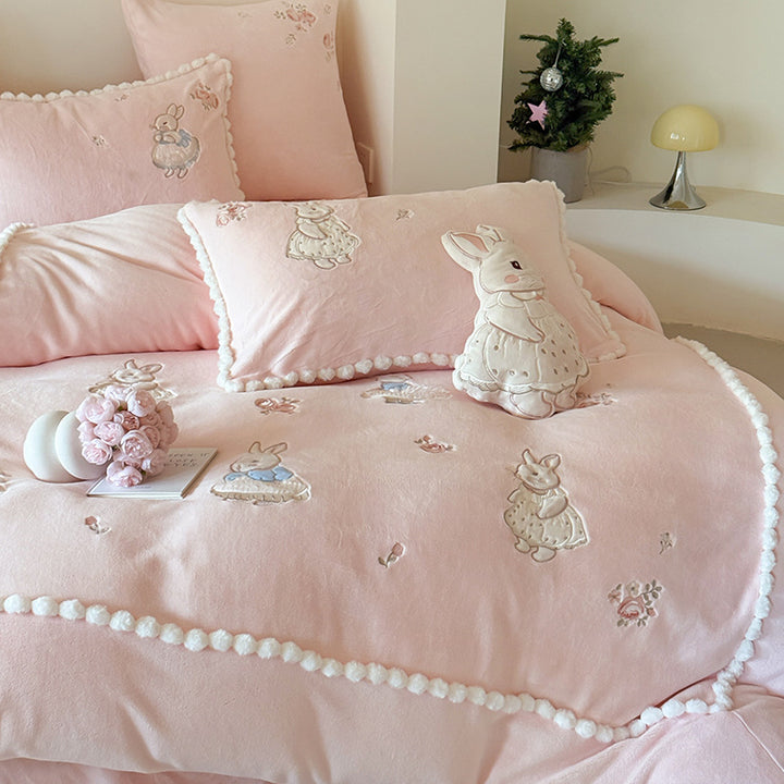 Cute cotton bedding set with embroidered bunny appliqués and pom-pom trim