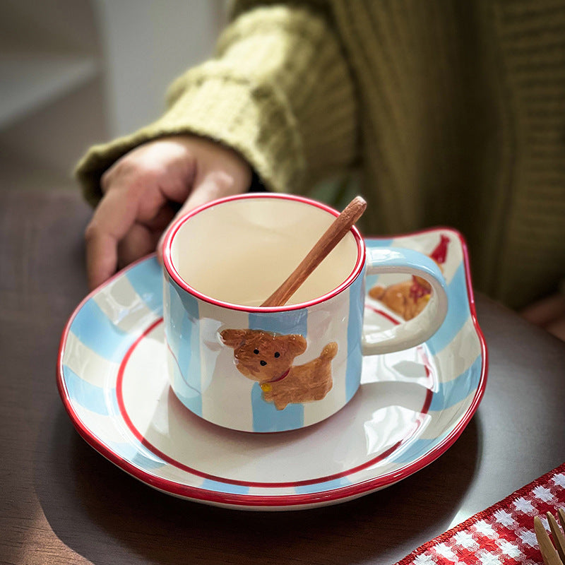 Ceramic cup set with saucer, hand-painted dog motif and wooden spoon