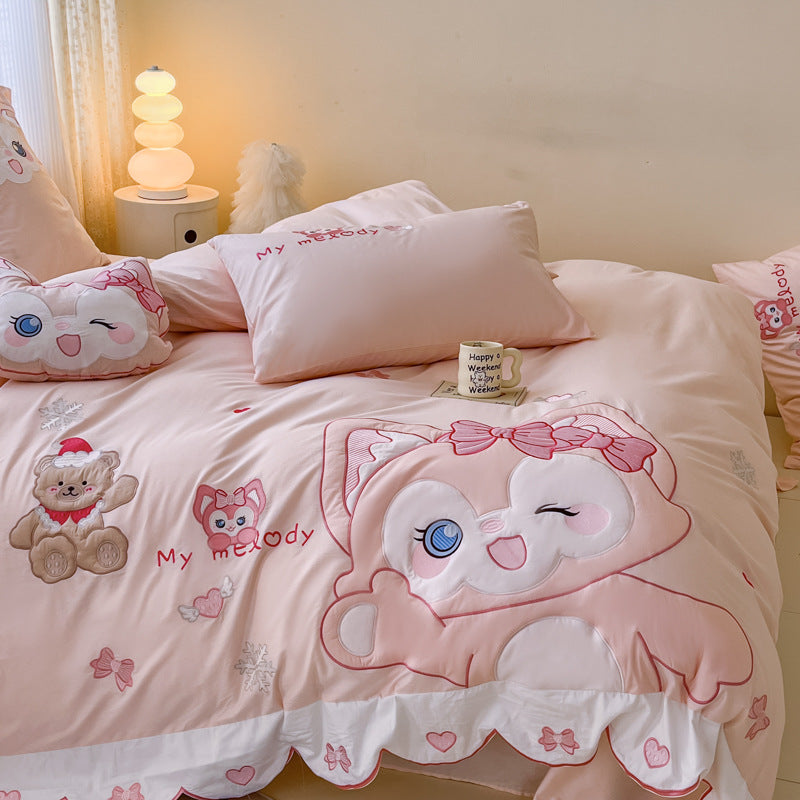 Playful children's bedding set with embroidered cat appliqué and cuddle pillow