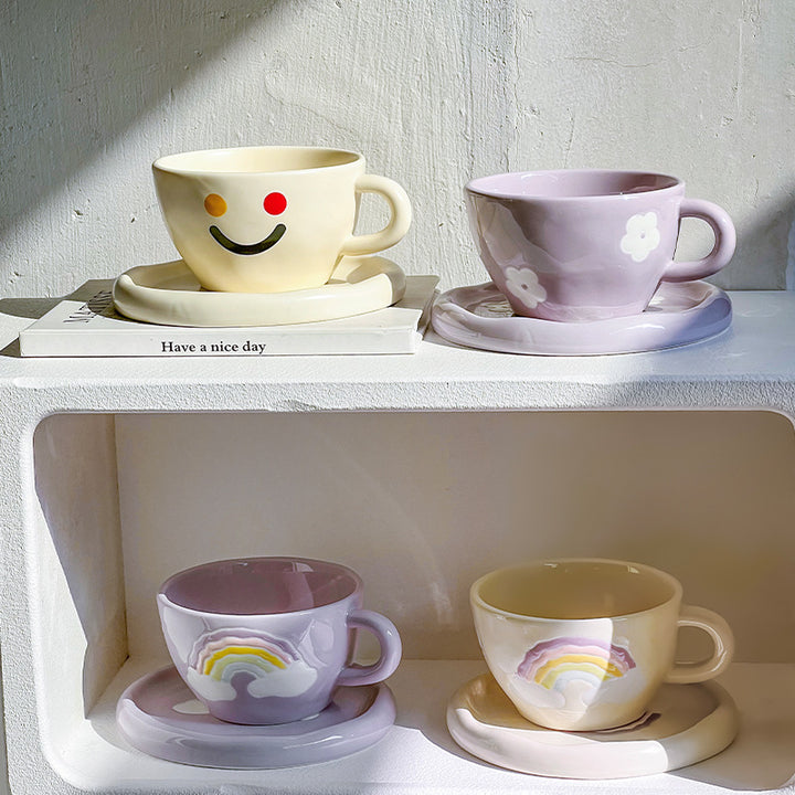 Handcrafted ceramic mug and plate set with cheerful smiley relief and organic shape