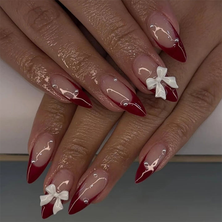 Artificial nail set with elegant bows and glitter accents Kalsten