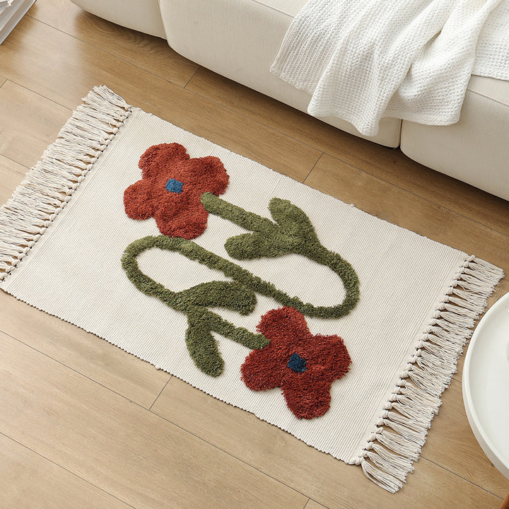 Decorative cotton bath mat with fringes and textured floral border