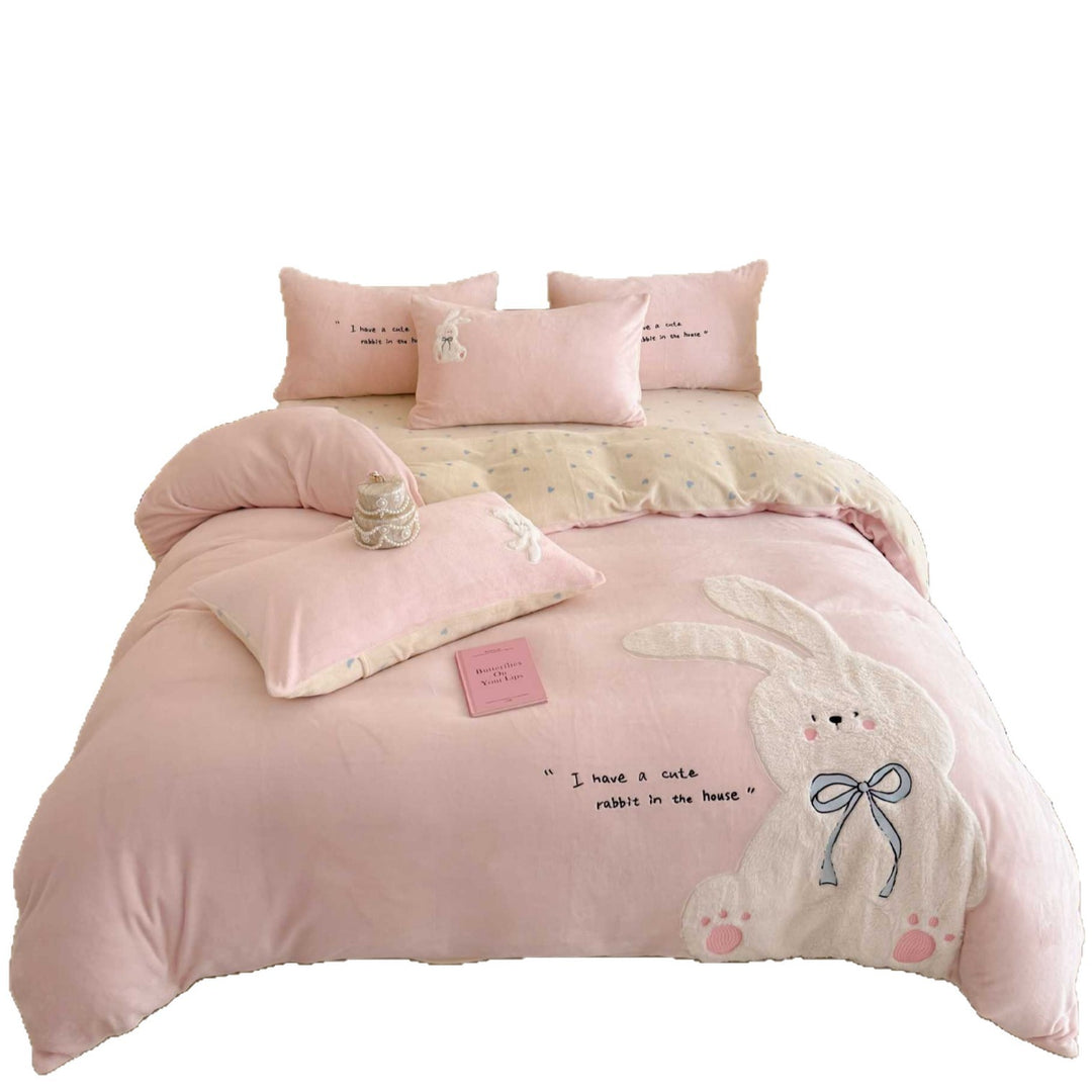 Cozy bedding set with embroidered rabbit appliqué and reversible cover