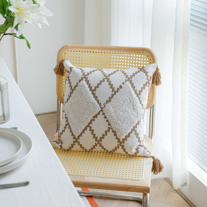 Decorative Boho cushion cover with hand-tufted diamond relief, tassels, and woven cotton blend Kalsten