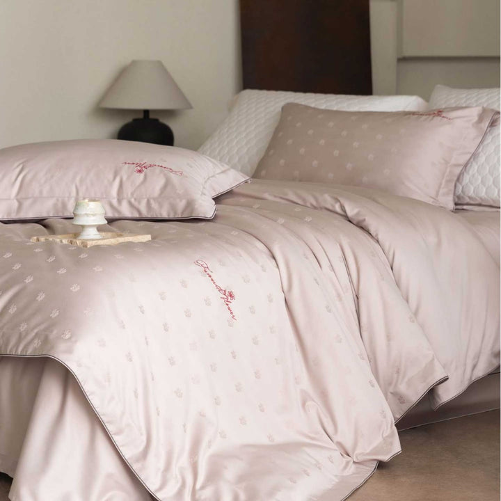 Luxurious satin bedding complete set with quilted cover and delicate logo embroidery