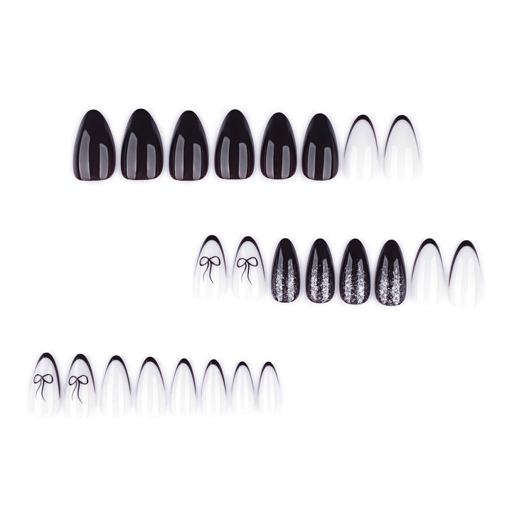 Artful nail art with elegant bow pattern and glitter accents Kalsten