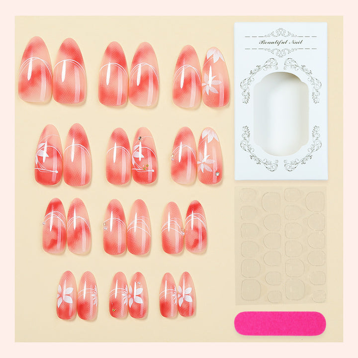 Acrylic nail set with elegant ombre design and floral accent Kalsten