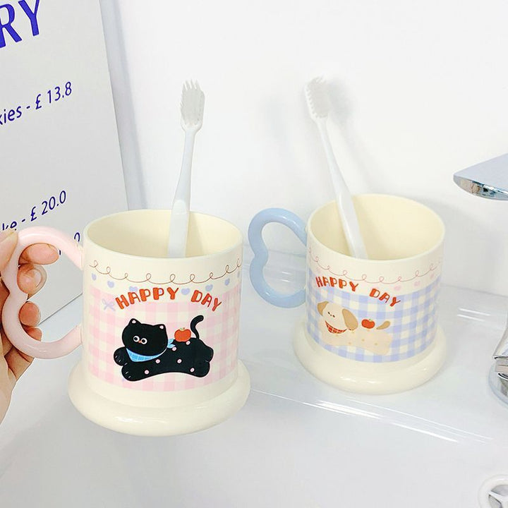 Ceramic mug with playful puppy motif Kalsten