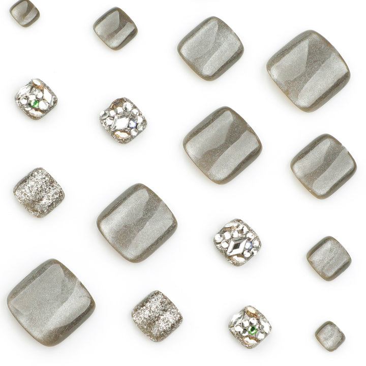 Artful toenail design with glitter and rhinestone decorations Kalsten