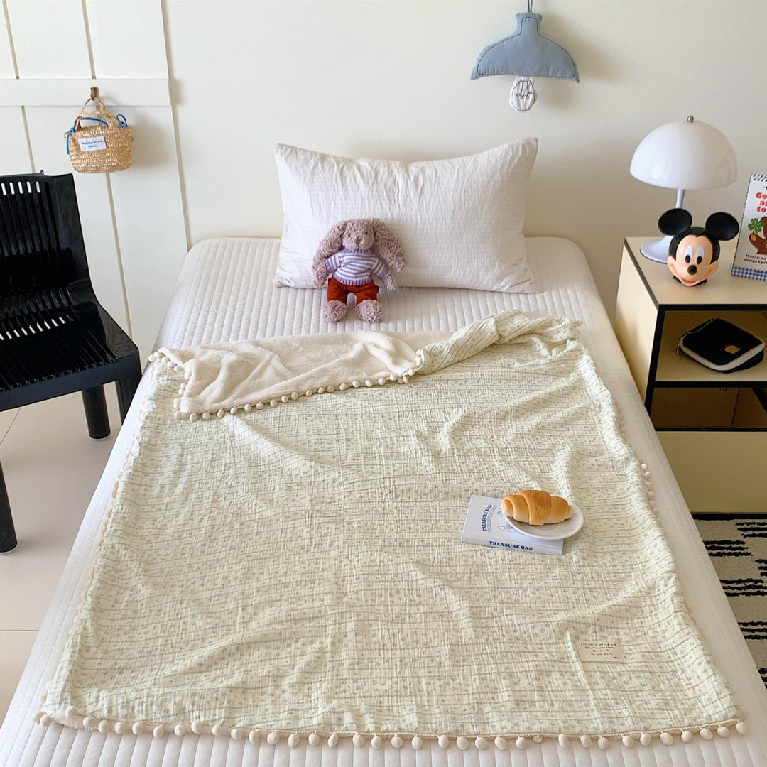 Children's Wende cuddly blanket made of cotton muslin with pompom border