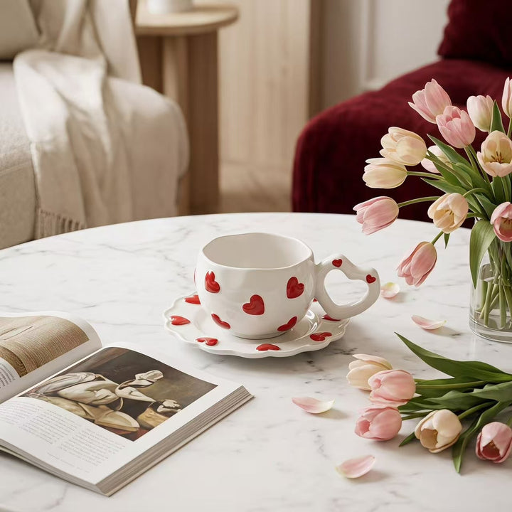 Porcelain cup set with heart-shaped handle and embossed decorative hearts