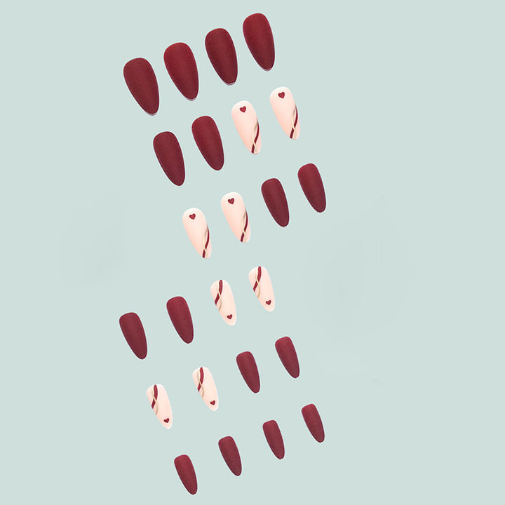 Artful and elegant artificial nails with heart decorations Kalsten